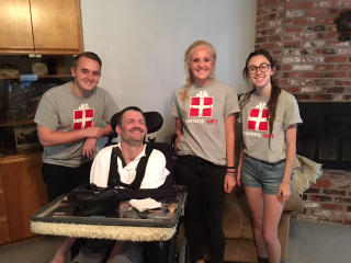 Dillon Hill, left, and other volunteers with Gamer’s Gift. Dominic Papa sits in front. Photo courtesy of Theresa Thorpe.